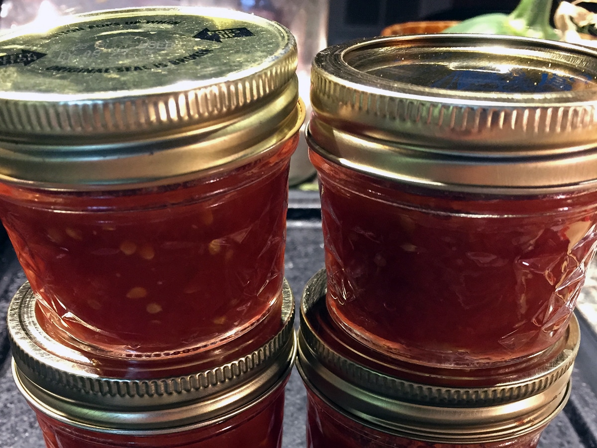 Small glass jars of weet tomato preserves