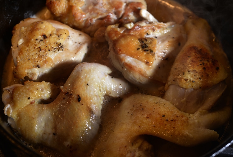 Close-up of vinegar-braised chicken on a pan