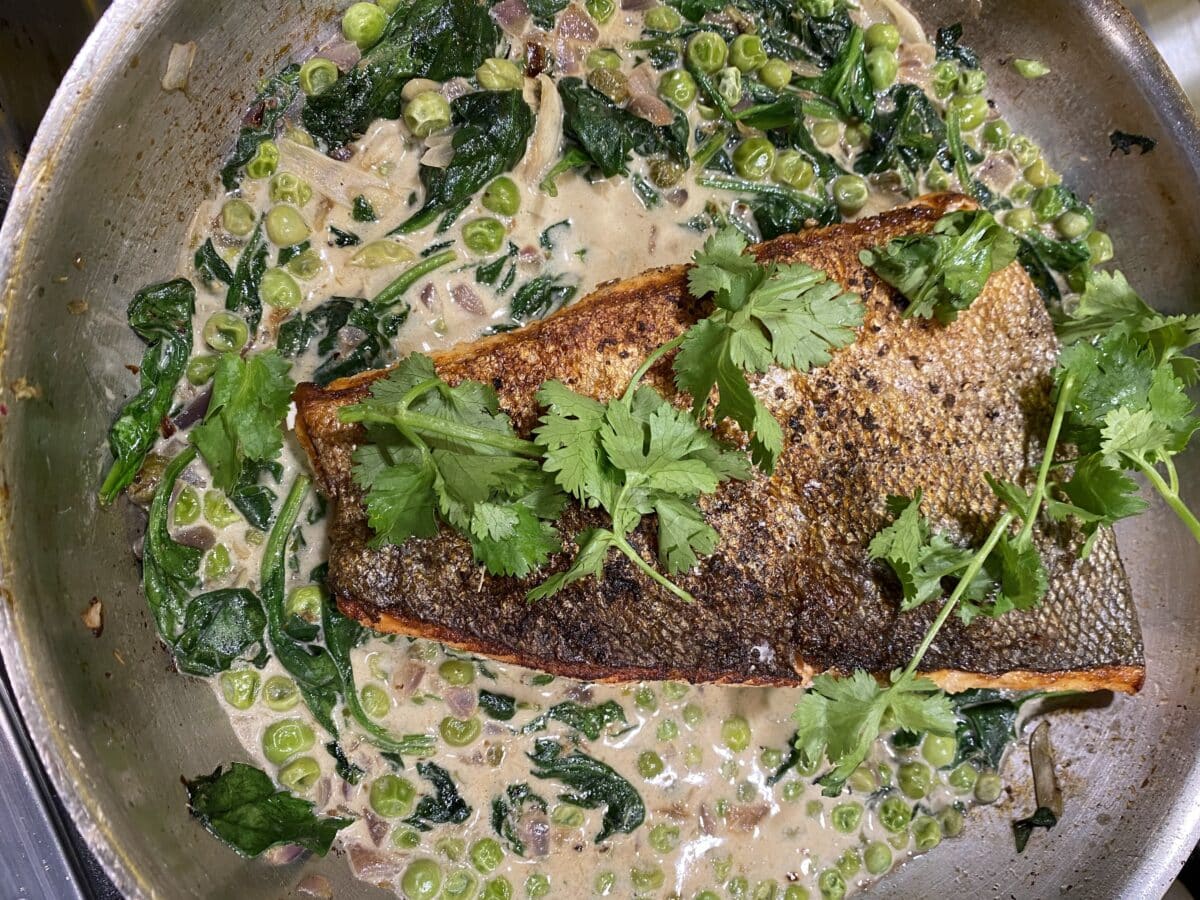 Crispy Salmon in pan cooking